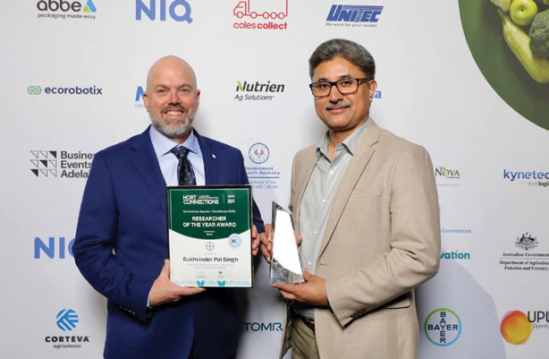 Darren Wood from Bayer presenting the Researcher of the Year award to Dr Sukhvinder Pal Singh