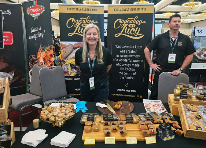 Meet the Buyer exhibitors at their stand with food products on display