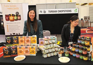 Exhibitors showcasing chopstick and condiment products
