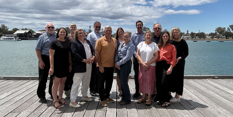 The Rural West team posing together on a jetty