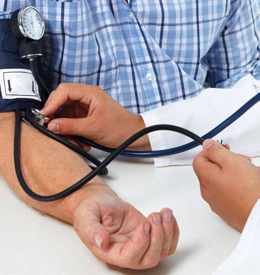 Doctor taking a patient's blood pressure with a stethoscope