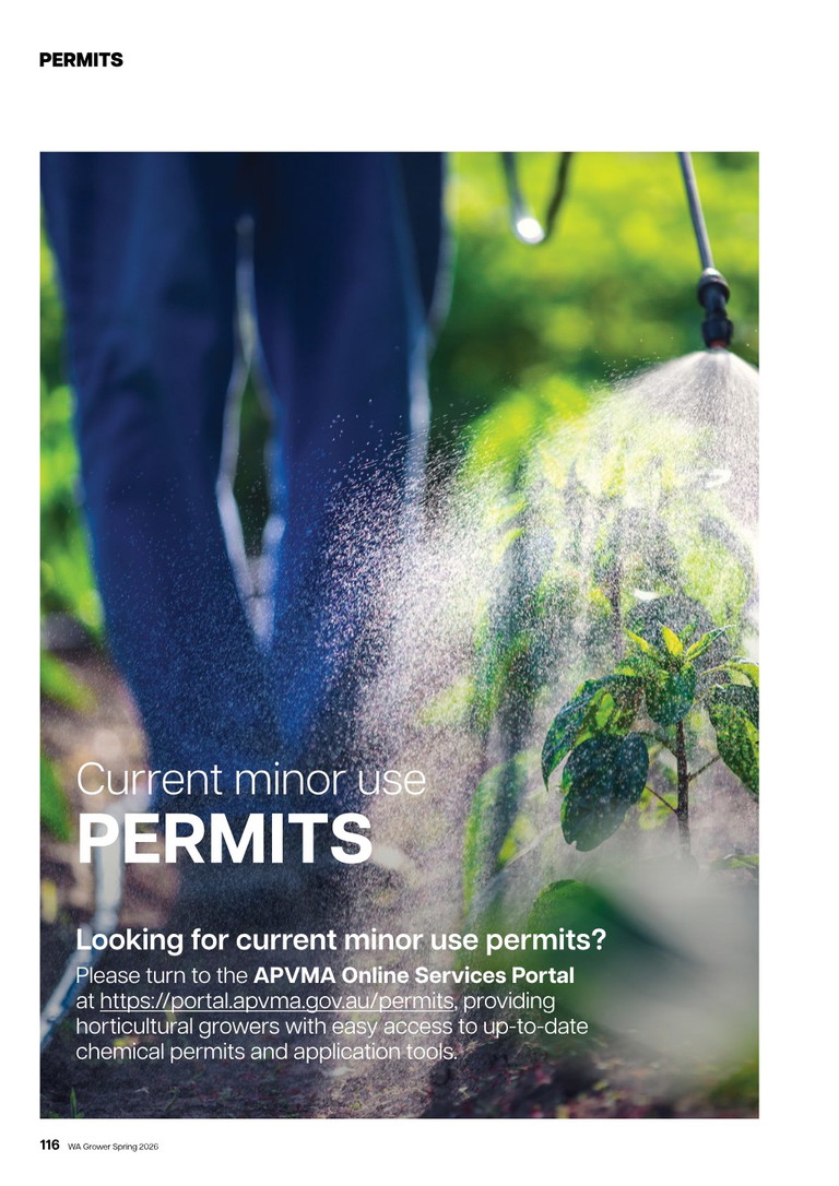 Farm worker spraying crops with a pesticide sprayer among green leafy plants